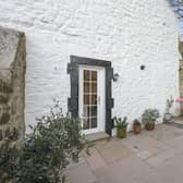 This quaint, 18th Century, B-Listed, one-bedroom, main door flat has an idyllic location in the desirable Cramond Village, a stone's throw from the River Almond and has stunning views of the Forth estuary and Fife coastline. The entrance to this property is through a pretty, communal, courtyard garden, with steps leading down to the private entrance. 