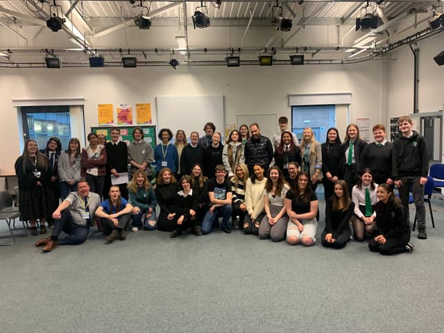 Actors Indira Varma (left of centre in blue top) and Ralph Fiennes (right of centre in black top) with the Edinburgh pupils at their acting workshop earlier this week at Forrester High School.