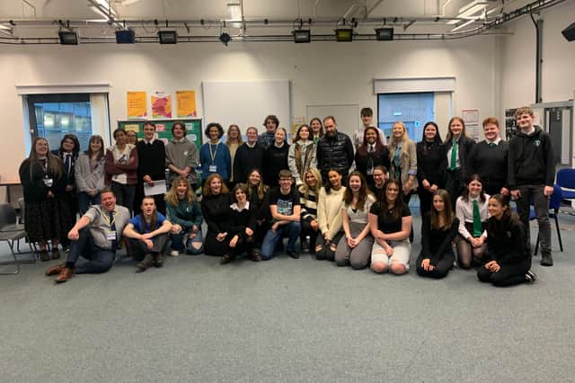 Actors Indira Varma (left of centre in blue top) and Ralph Fiennes (right of centre in black top) with the Edinburgh pupils at their acting workshop earlier this week at Forrester High School.