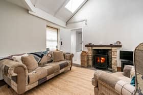 The beautifully presented living/kitchen/dining room, with a fantastic log burner, is the perfect place for relaxing with friends and family on those colder winter days and nights. With stunning high ceilings and Velux windows the room is flooded with natural light and is the true heart of the home. 