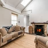 The beautifully presented living/kitchen/dining room, with a fantastic log burner, is the perfect place for relaxing with friends and family on those colder winter days and nights. With stunning high ceilings and Velux windows the room is flooded with natural light and is the true heart of the home. 