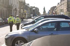Parking attendants on patrol in George Street - controls are set to be extended into the evenings.