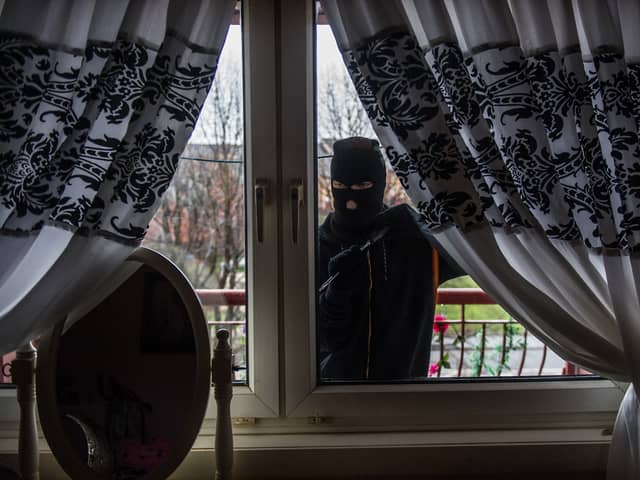 Stock photo of burglar. By John Devlin.