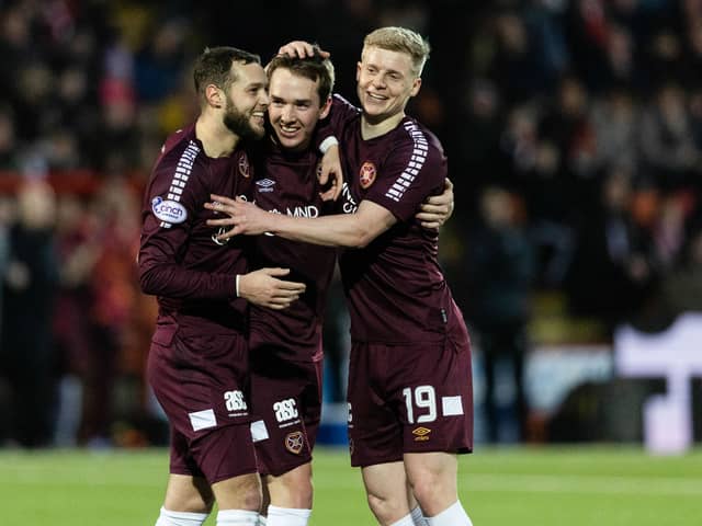 Hearts' Calem Nieuwenhof (centre) celebrates with Jorge Grant and Alex Cochrane after scoring to make it 3-0