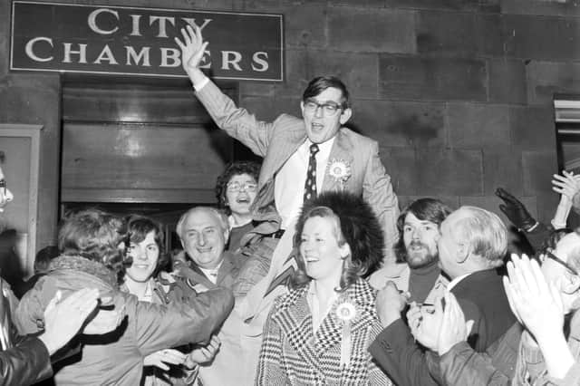 New SNP councillor Norman Irons is carried on the shoulders of supporters outside the City Chambers after winning a by-election in Drum Brae ward in January 1976. 