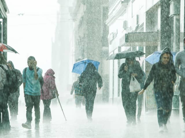 Showers are expected in Edinburgh this coming week. Photo by Toby Williams of shoppers on Princes Street in the rain.