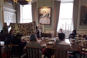 This is Rigged protesters occupy dining room at Holyrood Palace demanding action to tackle food insecurity.