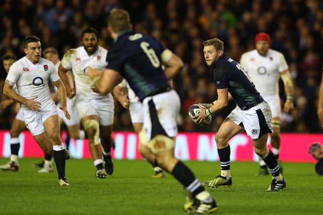 Finn Russell of Scotland passes the ball during the RBS Six Nations match between Scotland and England at Murrayfield Stadium on February 6, 2016. Getty Images.