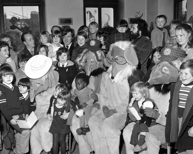 The Wombles help distribute Evening News/Odeon Charity Appeal Christmas presents at Leith hospital in December 1974.