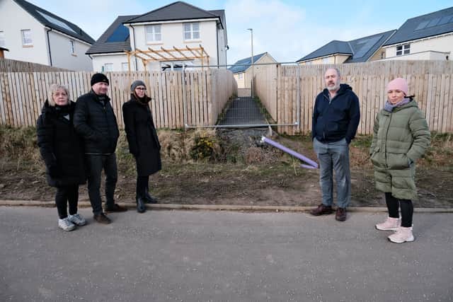 Residents in front of the Carnethy Heights site issues they have complained to Avant Homes about.