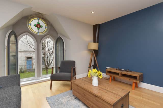 Natural light arrives through a pair of Lancet arches that include stunning circular stained glass windows. The proportions of the living room give plenty of flexibility for a range of different furniture arrangements. This will give a new owner plenty of flexibility to create their ideal entertaining space. 
