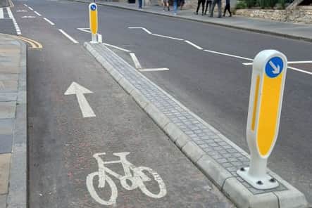 The proposed cycleway would be marked out with a kerb, like this one in Holyrood Road, rather than rubber lane defenders and plastic bollards often used.