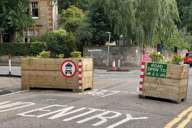 The planters blocking access on Braid Road may soon be disappearing.