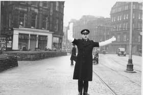 A policeman on points duty at the West End in 1954. Behind him is The Rutland Bar. 