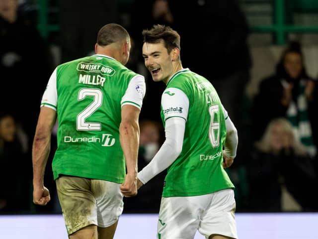 It's good to be back: Lewis Miller celebrates with Dylan Levitt at Easter Road.