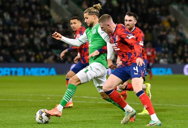 Emi Marcondes gets away from John Lundstram during the last meeting between Hibs and Rangers.