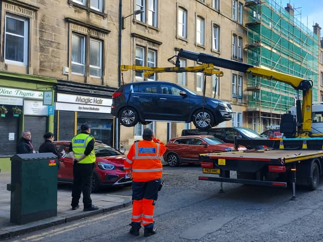 Vehicle lifted to be impounded on Brunswick Street in citywide crackdown