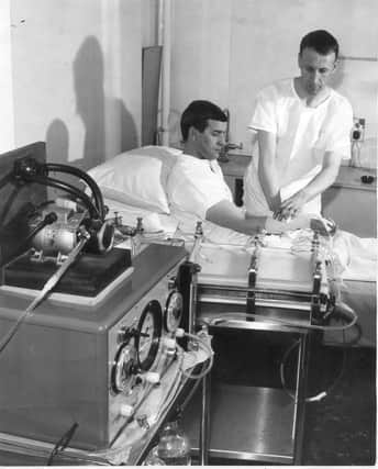 An "artificial kidney" at Edinburgh Royal Infirmary, April 1966.  "Technicians show how the machine is connected to the kidney patient.  An operation has to be performed on an artery to allow it to remain open. In this way the kidney machine can be used constantly." 
