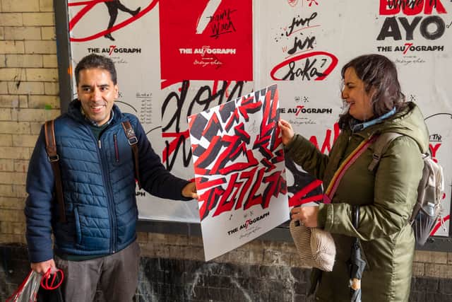 Emad and Marianne Nasserian were two of the lucky gunners who managed to find a rare Saka signed poster