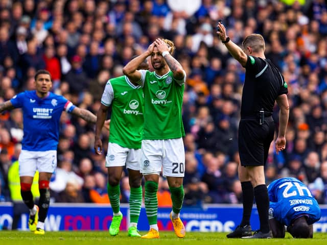 Head in hands, Emi Marcondes sums up the Hibs mood at Ibrox.