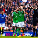 Head in hands, Emi Marcondes sums up the Hibs mood at Ibrox.