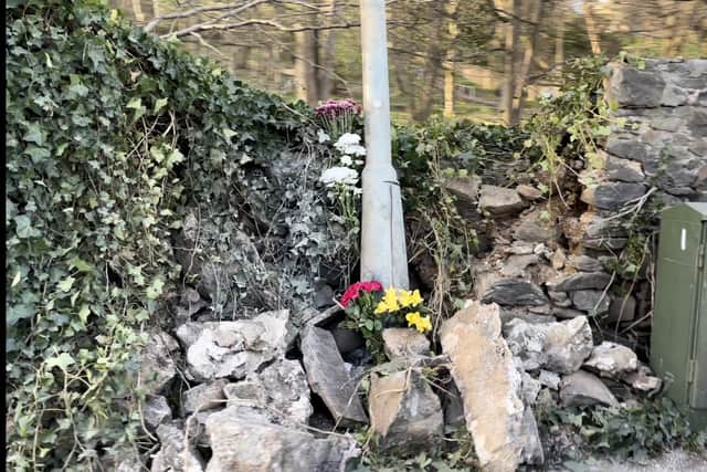 Floral tributes have been left at the site of a fatal car crash on Corstorphine Road in Edinburgh

