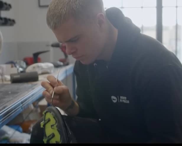 Boots N Pieces founder Ryan Park hard at work in his Leith office converting football boots.