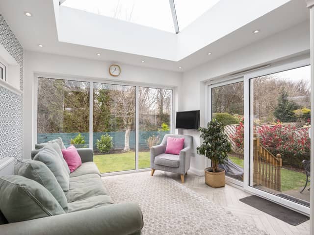The  fabulous light filled garden room with patio doors leading to the rear garden.
