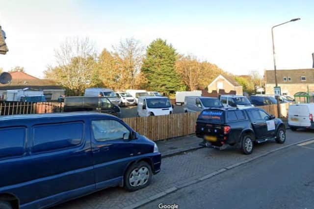The vacant lot in Winchburgh , once the site of the Star and Garter, is used by a garage business to store cars Planning permission has been granted to develop it for residential use. Copyright Google Images.