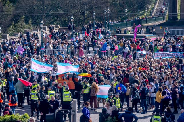 Anti-transgender rights activists and transgender rights counter protestors at the Let Women Speak rally at The Mound.  Picture: Jane Barlow/PA Wire