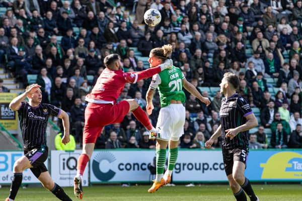 No hard feelings? Mitov and Marcondes clash at Easter Road. 