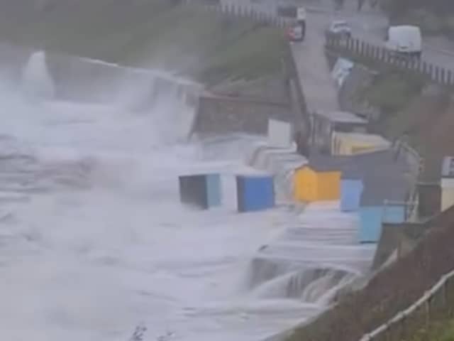 Huge waves and battering winds have washed newly-painted huts on Castle Beach, Falmouth, into the ocean.