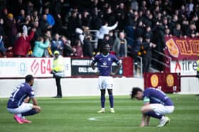 L-R: Obita, Youan and Newell look dejected as Hibs fail to make top six, courtesy of a late Motherwell equaliser at Fir Park.