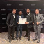 Bombay Lounge staff Mr Aminul, Mr Rahat and Mr Ali (left to right) with manager Michael Singh (second from right), collect their Scottish Curry Award.