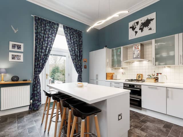 At the back of the property, there is a modern fitted kitchen with integrated appliances and breakfast bar as well as access to the private terrace through a recently replaced patio door. 