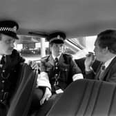Police give a man a breathalyzer test in this posed picture from October 1979.