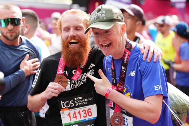 Russ Cook with Chris Evans after finishing the  TCS London Marathon. Picture date: Sunday April 21, 2024. PA Photo. Photo credit should read: John Walton/PA Wire
