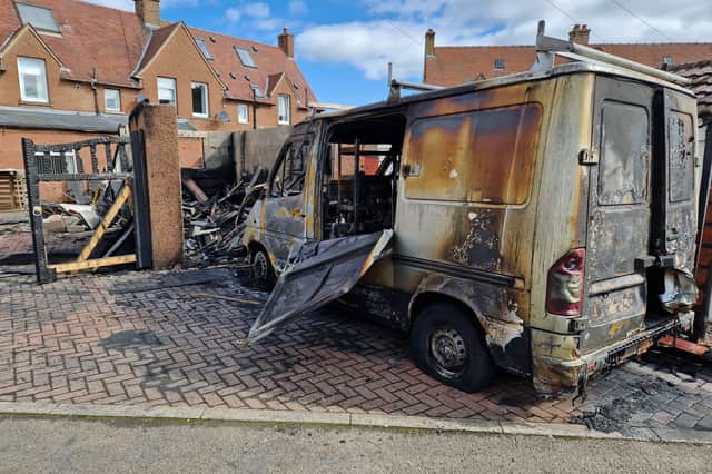 The scene next to the destroyed garage (centre) this morning. The fire broke out at a garage at the back of Pentland Crescent, Rosewell on Tuesday, April 23 at around 9pm.