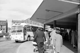 Passengers head off on a trip from the bus station at Clyde Street, off St Andrew Square, Edinburgh.