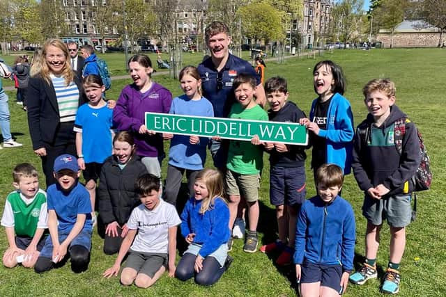 Morningside councillor Marie-Clair Munro and rugby star Darcy Graham are joined by children at Bruntsfield Links for the unveiling ceremony.