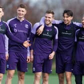 In the thick of it - Cadden (centre) has been hailed as an example to every potential Hibs player. Could he do a turn for Scotland?