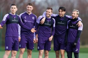 In the thick of it - Cadden (centre) has been hailed as an example to every potential Hibs player. Could he do a turn for Scotland?