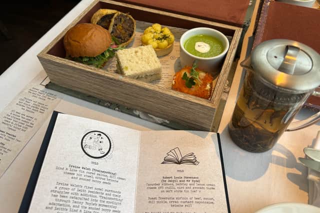 The author-inspired savoury bites are served in a book-shaped tin 