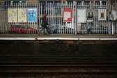A person walks along a railway platform at Paddock Wood railway station in south east England on April 8, 2024, as train drivers strike over pay. (Photo by BEN STANSALL/AFP via Getty Images)
