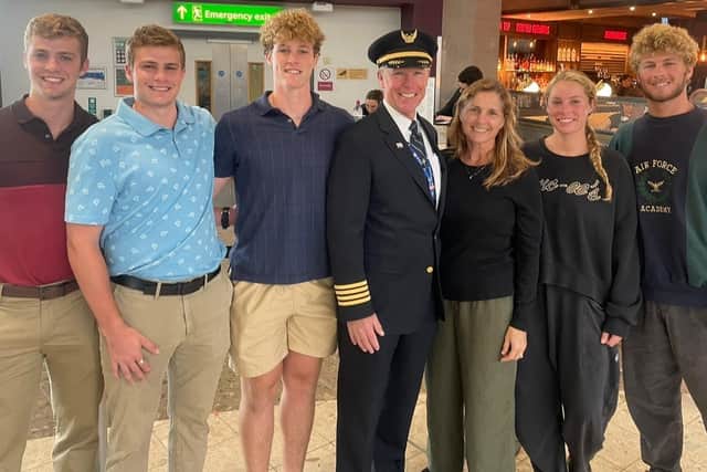 United Airlines pilot Joe Fox with his family at Edinburgh Airport