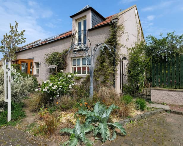 This three-bedroom country cottage is up for sale.