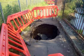 A giant sinkhole has appeared on the canal path near the Longstone Inn in Edinburgh. 