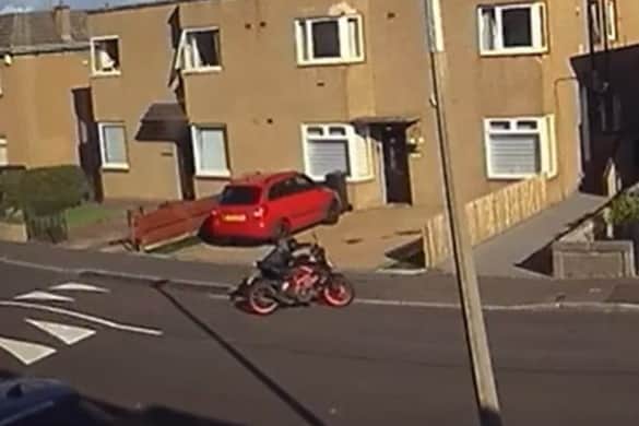 The thief makes his way down Northfield Farm Avenue after stealing it at around 6pm on Saturday, August 3.