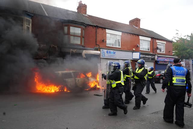 A car burns in Middlesbrough during violence and disorder on Sunday