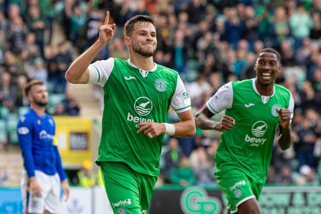 Kuharevich celebrates making it 1-0 with team-mate - and assist provider - Marvin Ekpiteta.